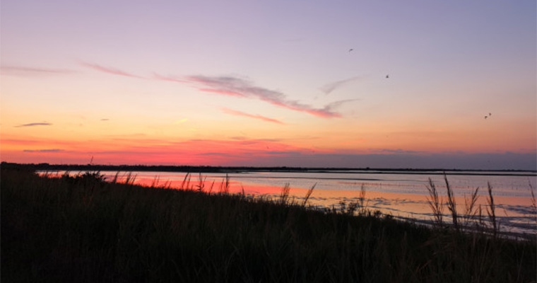 Escursione al tramonto, tra specchi d'acqua, luce e silenzi